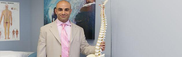 Hooman Melamed Holding A Spine